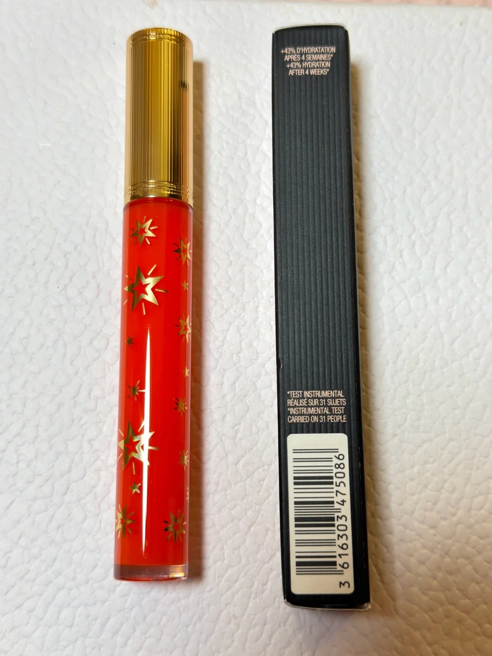 Gucci Orange-Red Lip Gloss with Gold Star Accents